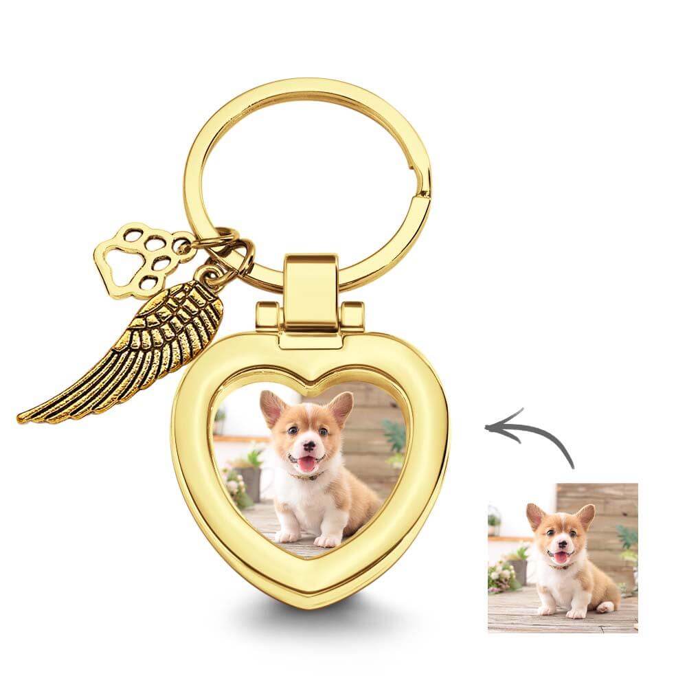 Gold heart-shaped pet photo keychain with paw and wing charms